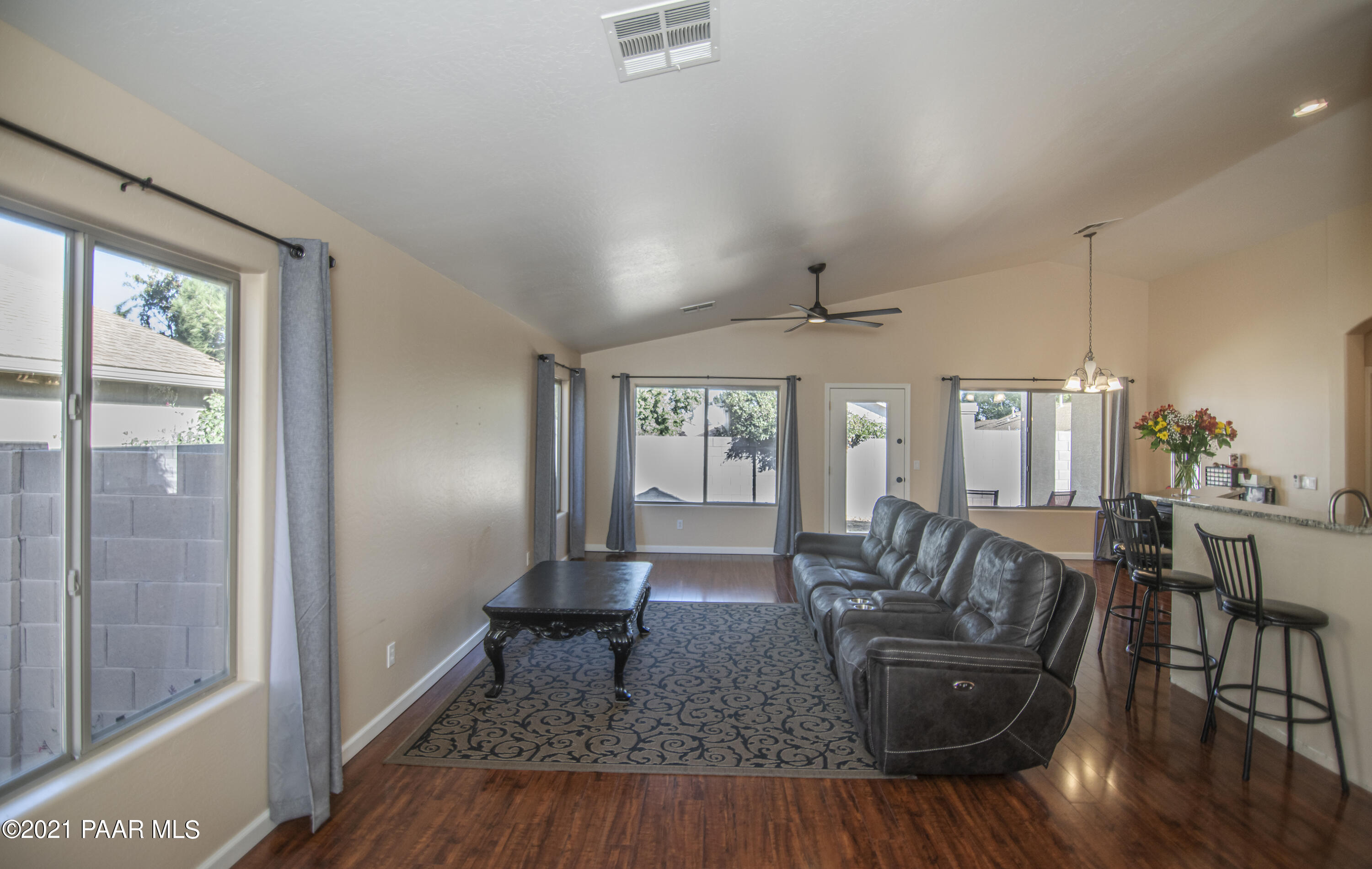 7402 East Plateau Ridge Road Prescott Valley, AZ 86315 - Photo 7 of 31 a living room with furniture and wooden floor