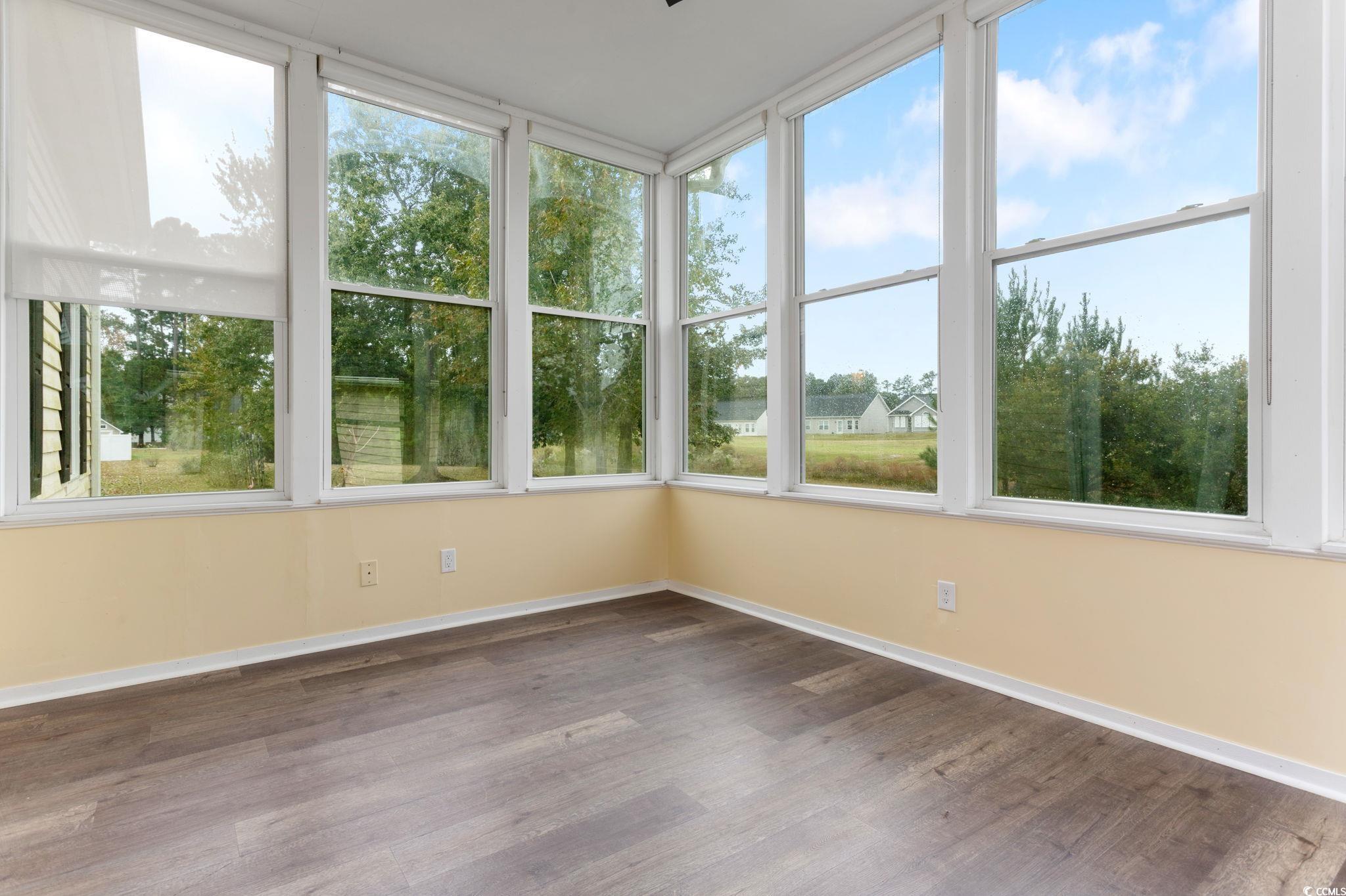 2321 Brick Drive Longs, SC 29568 - Photo 30 of 40 Unfurnished sunroom featuring healthy amount of natural light and wood finished floors