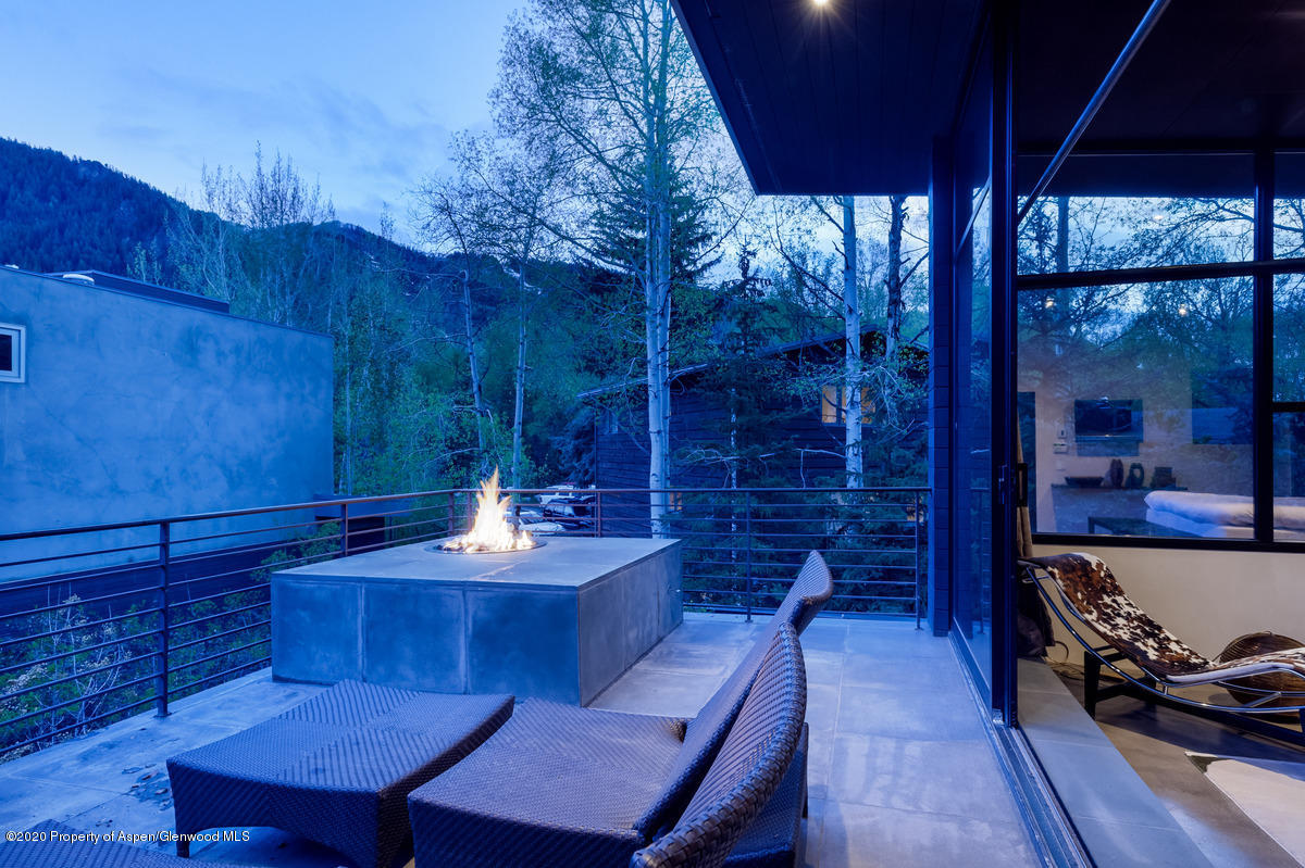 263 Park Avenue Aspen, CO 81611 - Photo 14 of 32 a view of a dining room with furniture window and wooden floor