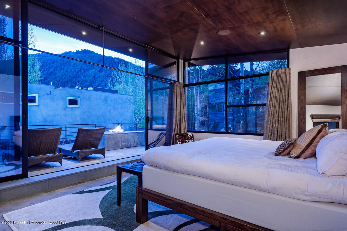 263 Park Avenue Aspen, CO 81611 - Photo 15 of 32 a bed room with a bed and a television