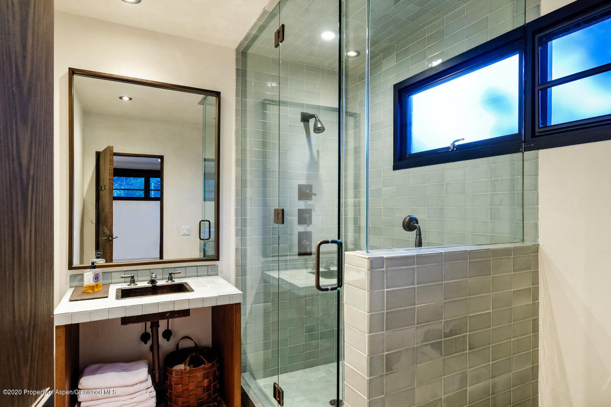 263 Park Avenue Aspen, CO 81611 - Photo 18 of 32 a bathroom with a sink a toilet and shower