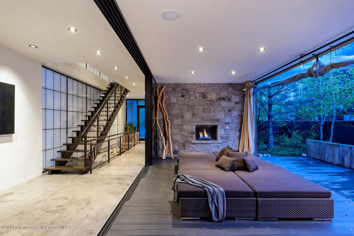 263 Park Avenue Aspen, CO 81611 - Photo 2 of 32 a living room with furniture and a fireplace