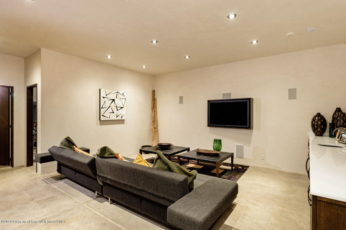 263 Park Avenue Aspen, CO 81611 - Photo 23 of 32 a living room with furniture and a flat screen tv