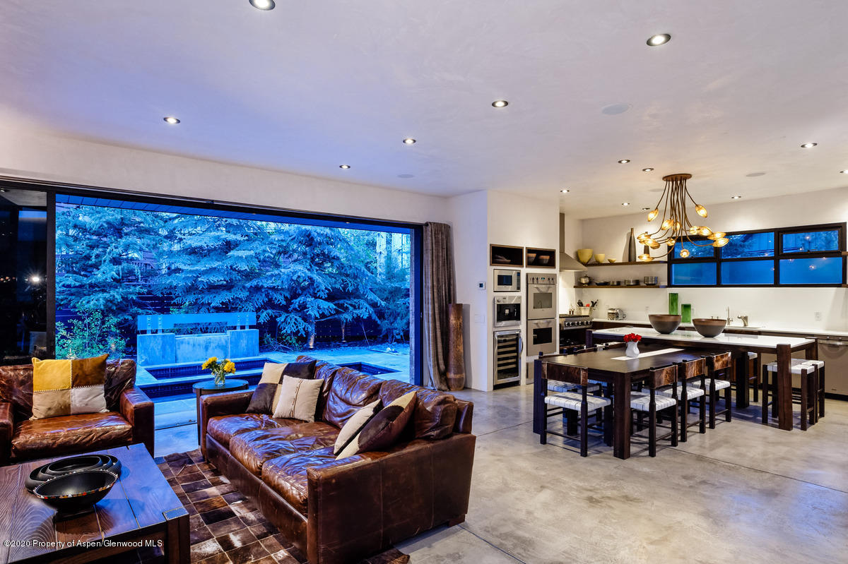 263 Park Avenue Aspen, CO 81611 - Photo 8 of 32 a living room with furniture and a large window