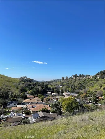 a view of a town with mountains in the background