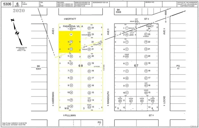 a view of a tennis ground with a large trees