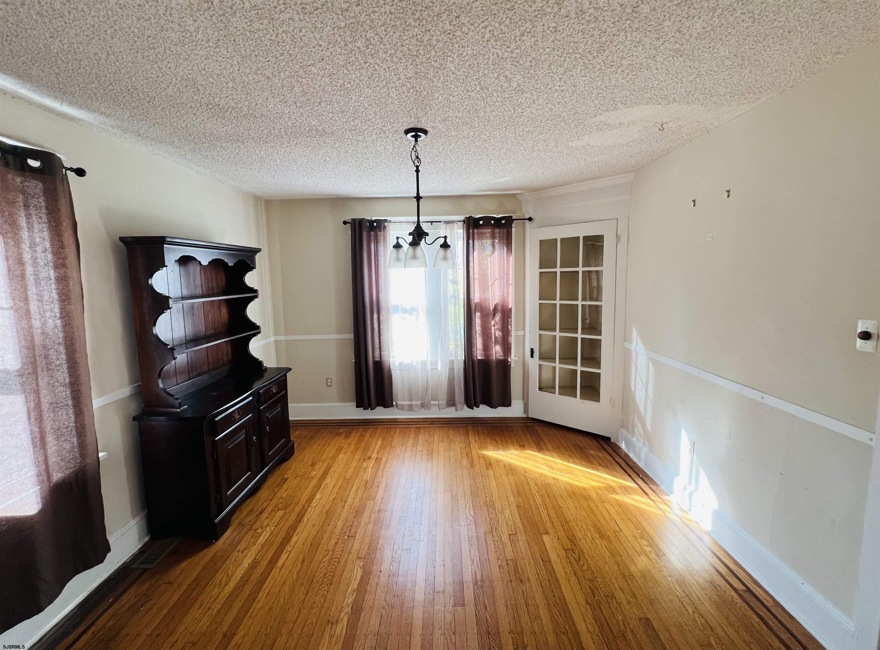 194 North Shore Road Absecon, NJ 08201 - Photo 7 of 14 wooden floor in an empty room with a window