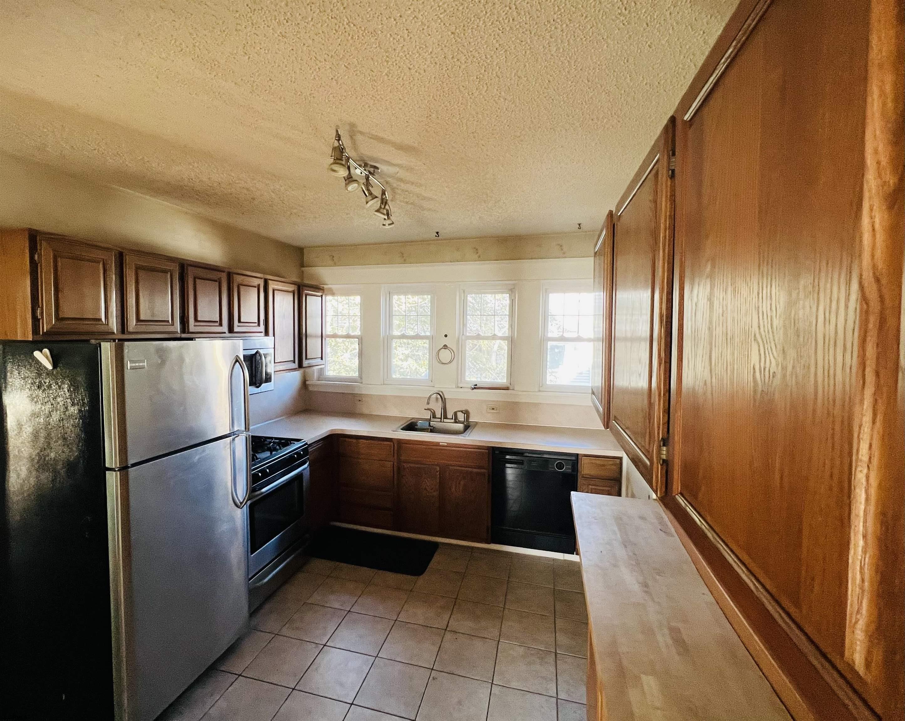 194 North Shore Road Absecon, NJ 08201 - Photo 9 of 14 a kitchen with stainless steel appliances granite countertop a refrigerator and a sink