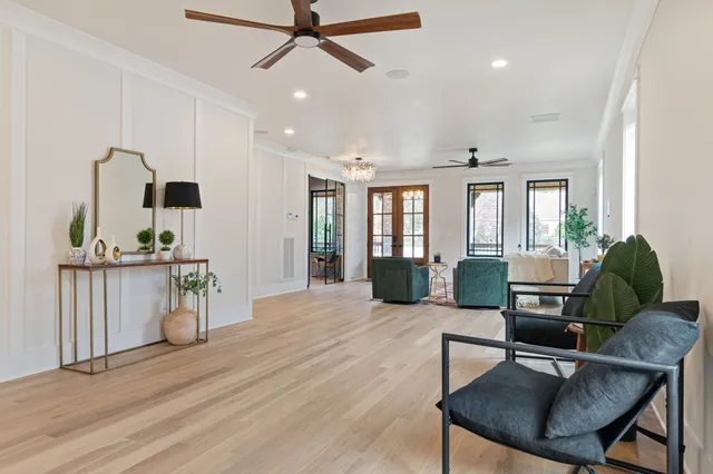 a view of a hallway with wooden floor and entryway