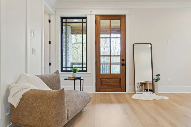 a view of balcony with a potted plant and outdoor seating