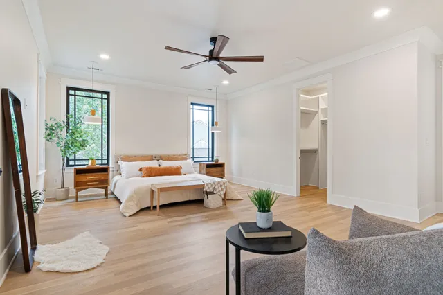 an aerial view of a house with a mountain