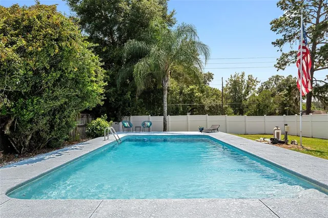 a outdoor dining space with furniture and garden view