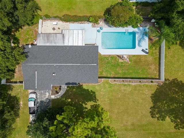 a view of a swimming pool with a patio