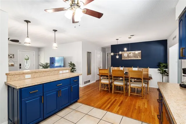a dining room with a sink and breakfast area