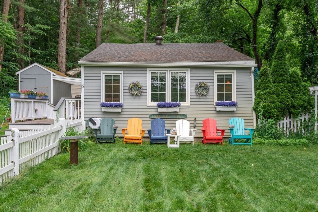 6 Craig Road Holland, MA 01521 - Photo 1 of 28 a front view of house with yard and outdoor seating