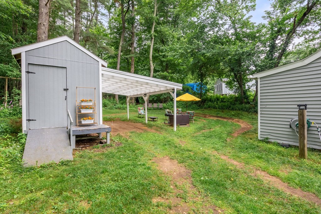 6 Craig Road Holland, MA 01521 - Photo 22 of 28 a view of a house with a yard and sitting area