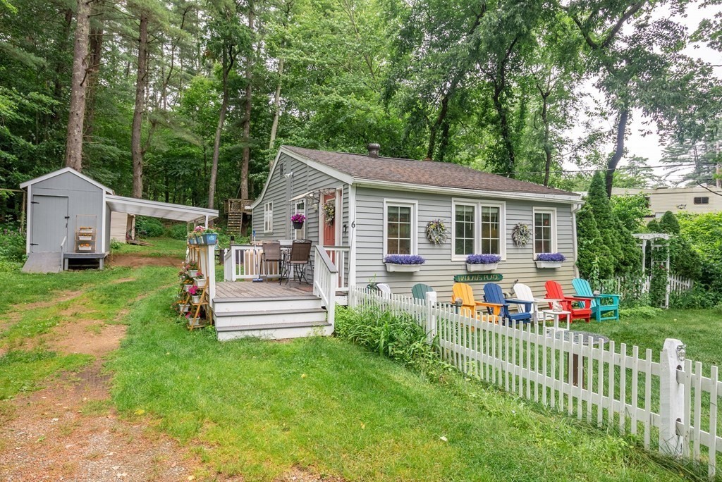 6 Craig Road Holland, MA 01521 - Photo 3 of 28 a front view of house with yard and green space