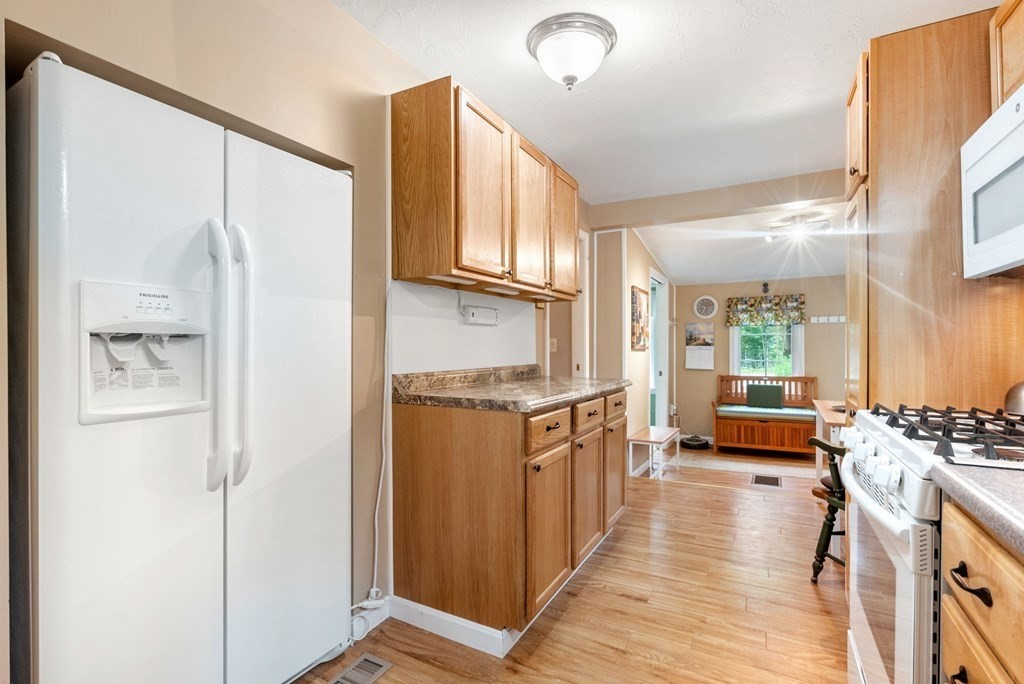 6 Craig Road Holland, MA 01521 - Photo 9 of 28 a kitchen with stainless steel appliances granite countertop a refrigerator a stove and a refrigerator