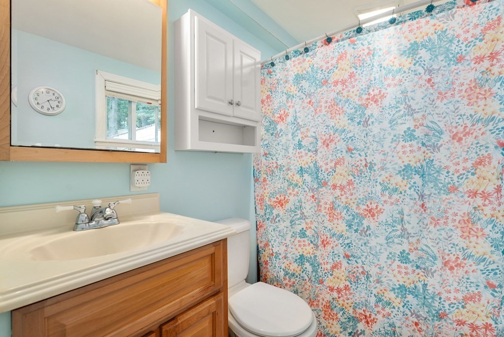 6 Craig Road Holland, MA 01521 - Photo 10 of 28 a bathroom with a sink toilet and mirror