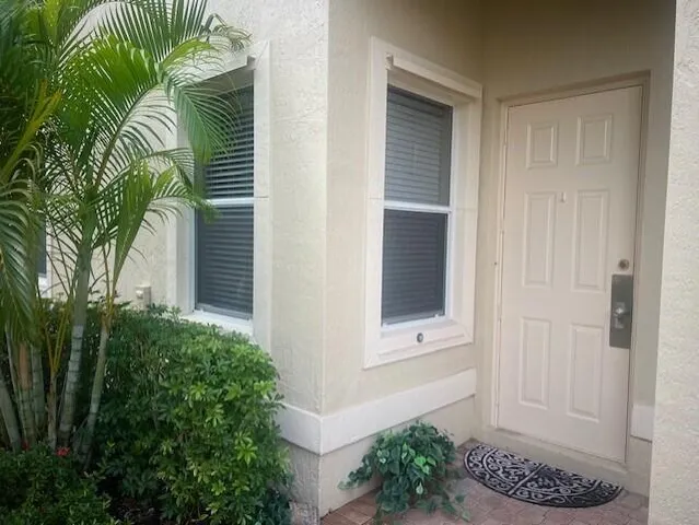 a view of small house with a plant