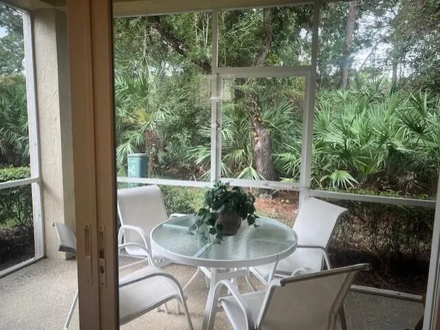 a view of table and chair in the balcony