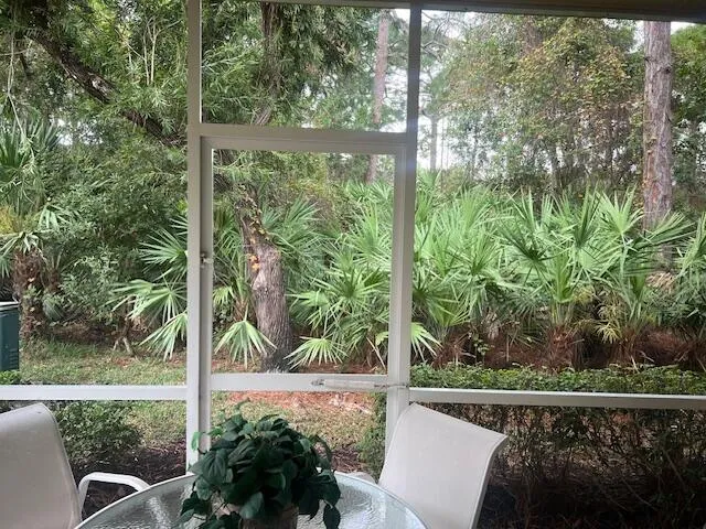 a view of a chair and table in the balcony