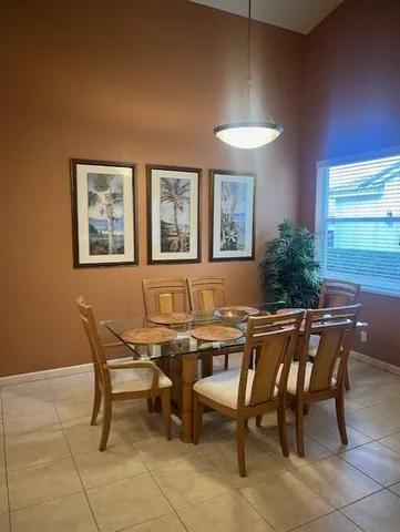a dinning table and chairs in a room