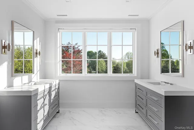 a bathroom with a sink and a large window