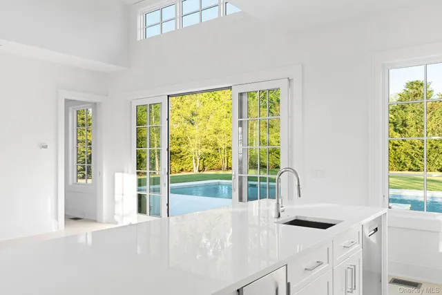 a kitchen with a sink and a window