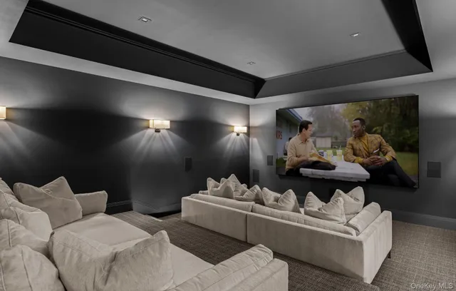 a living room with furniture and a wall painting