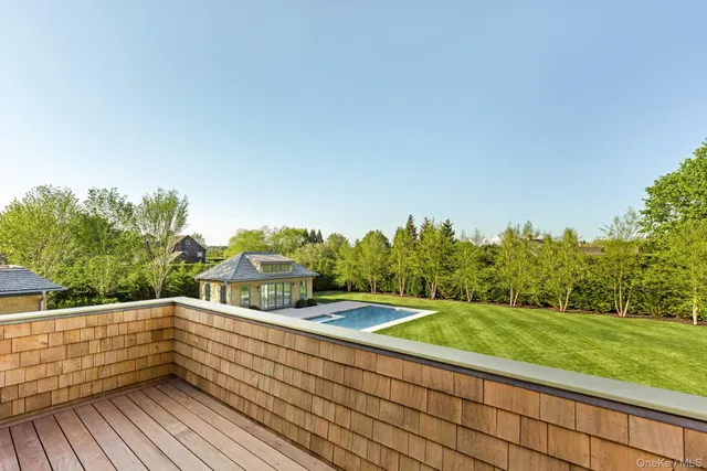 a view of a balcony with trees