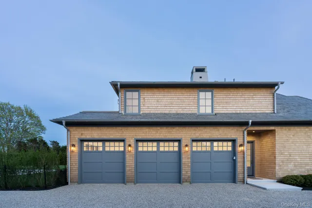 a front view of a house with garage