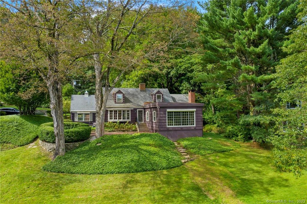7 Johnson Road Chester, CT 06412 - Photo 1 of 1 a front view of a house with a yard and large trees