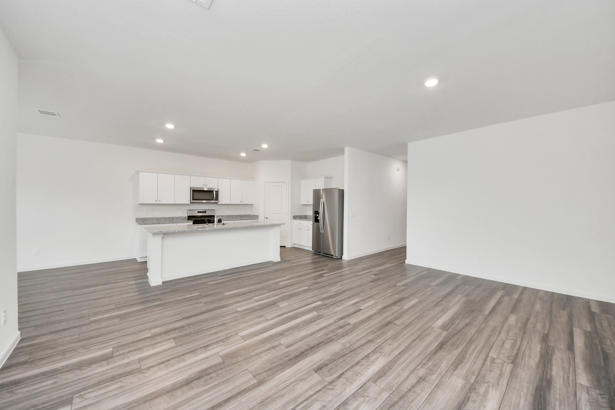10309 Malta Trce Drive Rosharon, TX 77583 - Photo 8 of 49 a view of kitchen with granite countertop a stove top oven