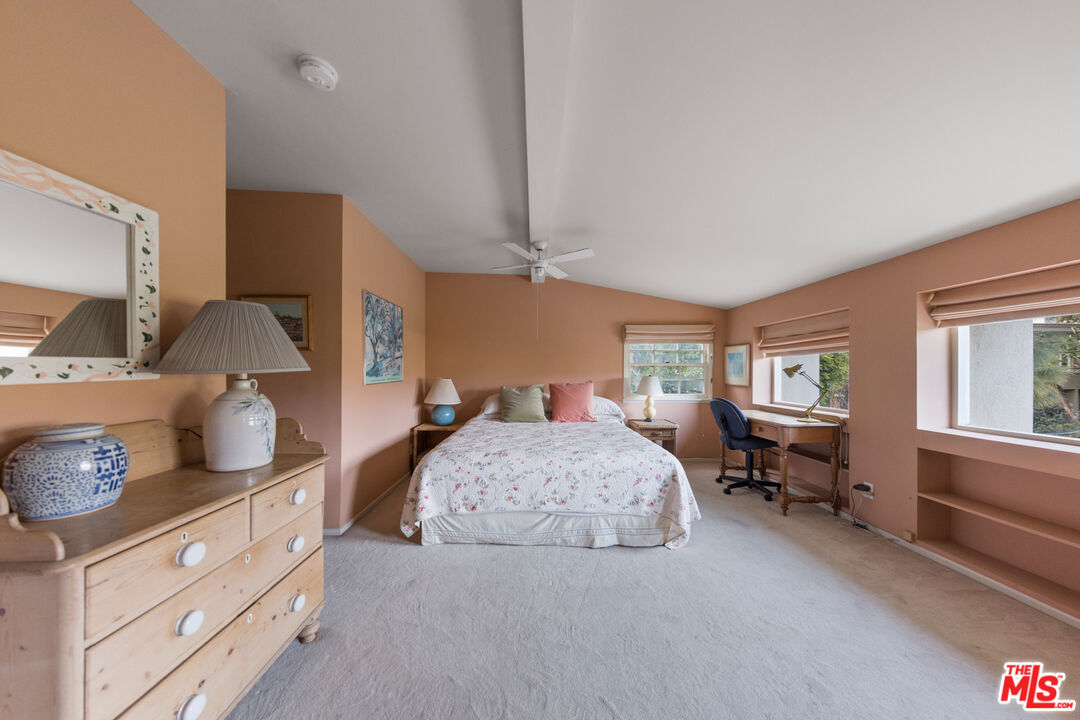 635 North Bonhill Road Los Angeles, CA 90049 - Photo 11 of 19 a spacious bedroom with a bed and wooden floor