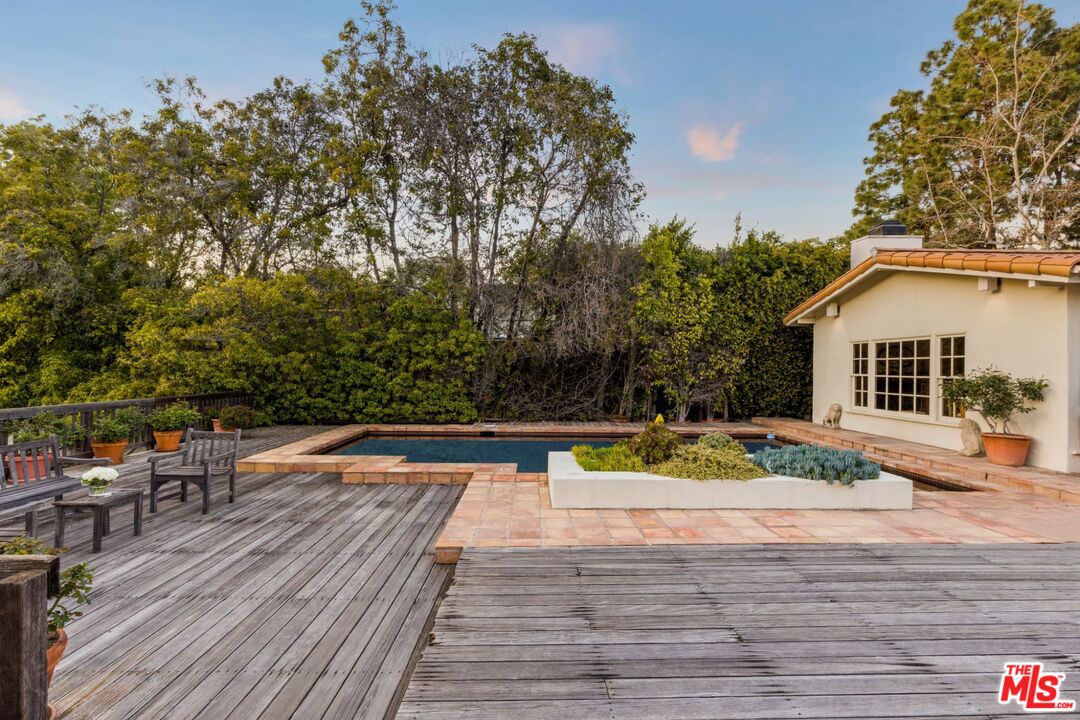 635 North Bonhill Road Los Angeles, CA 90049 - Photo 16 of 19 a view of a house with pool