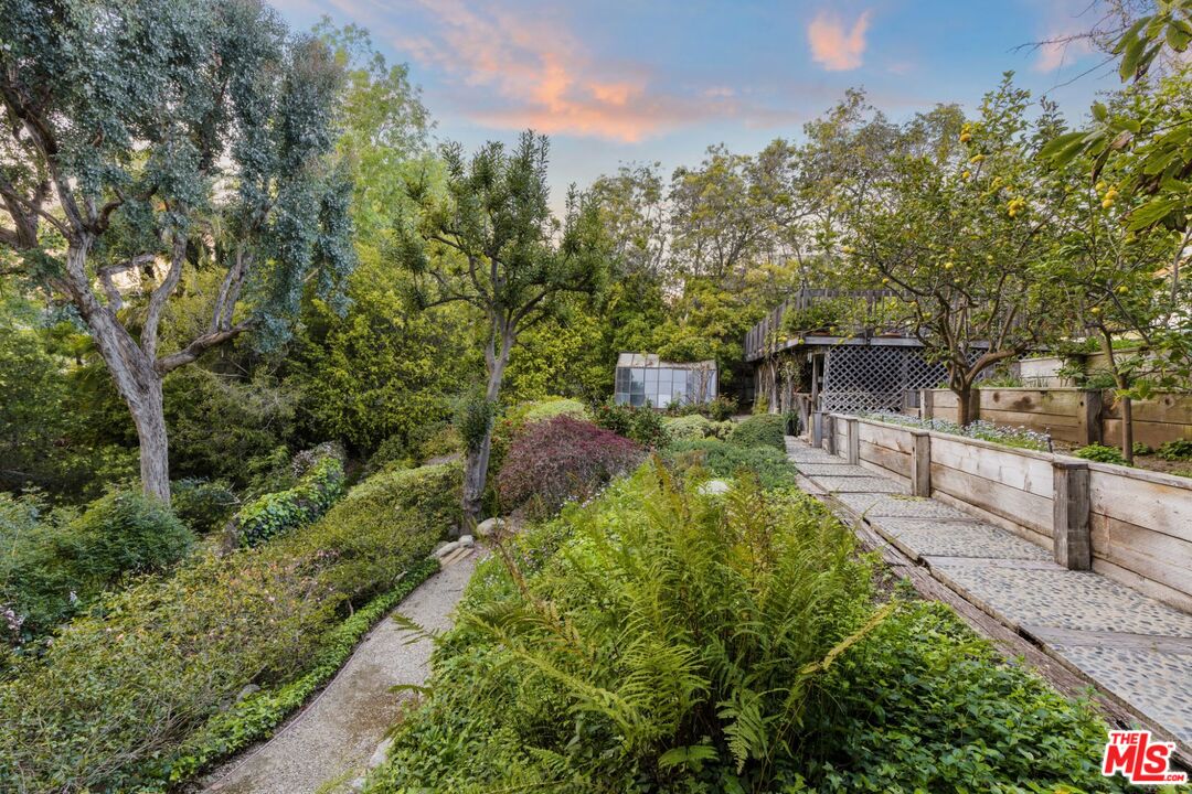 635 North Bonhill Road Los Angeles, CA 90049 - Photo 17 of 19 a view of a garden with pathway