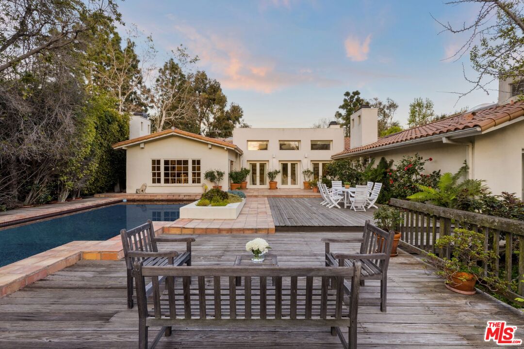 635 North Bonhill Road Los Angeles, CA 90049 - Photo 19 of 19 a view of a house with wooden deck and furniture