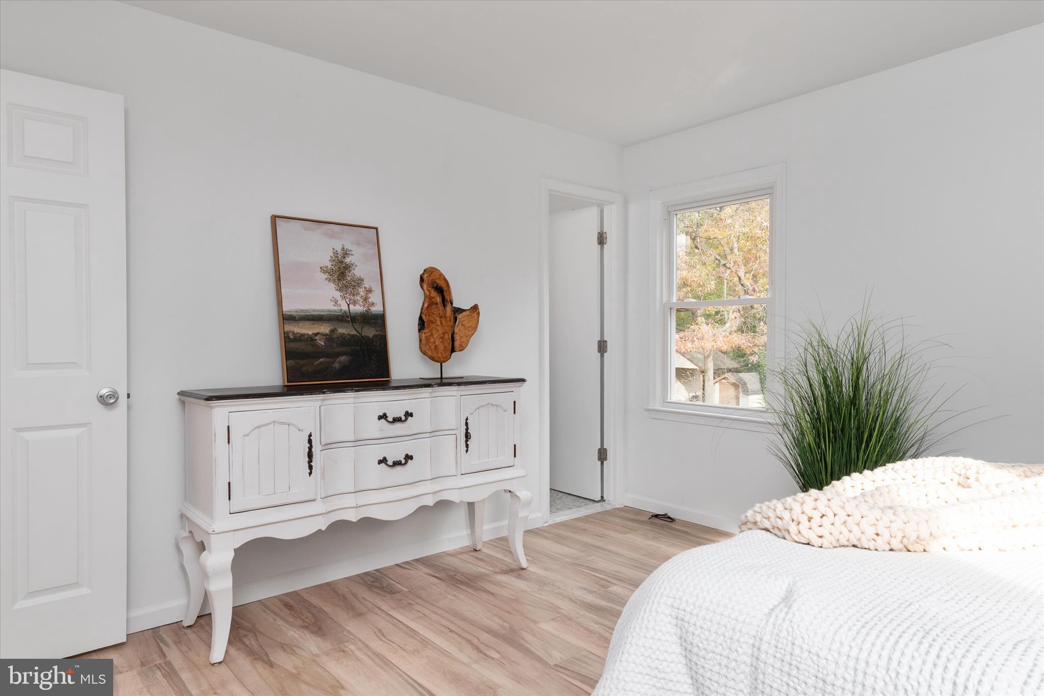 7963 Oak Road Pasadena, MD 21122 - Photo 14 of 53 a bedroom with a bed and a window