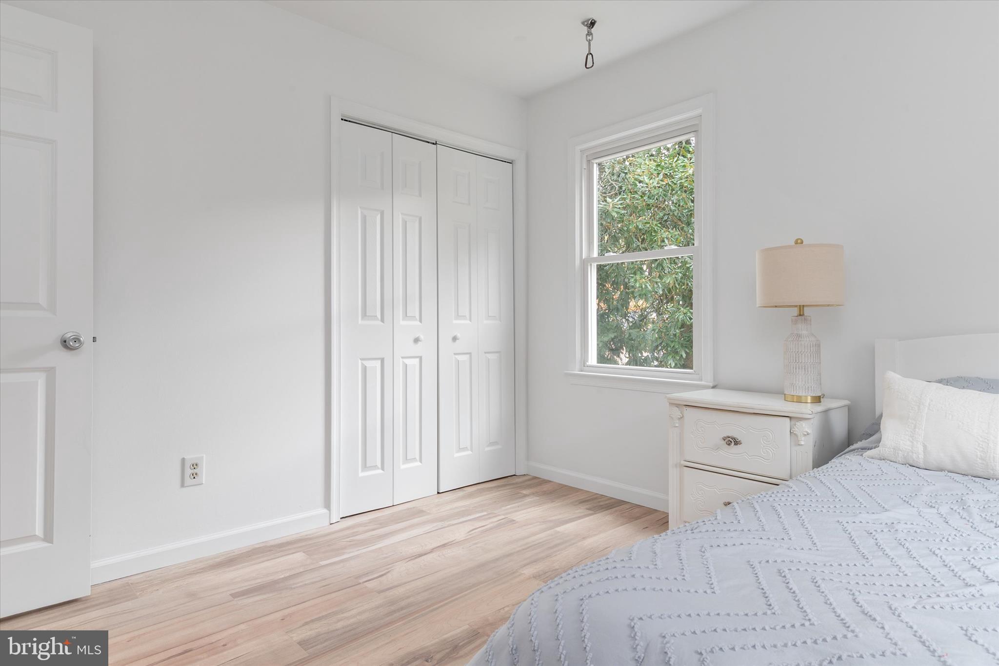 7963 Oak Road Pasadena, MD 21122 - Photo 19 of 53 a view of a bedroom with wooden floor and window