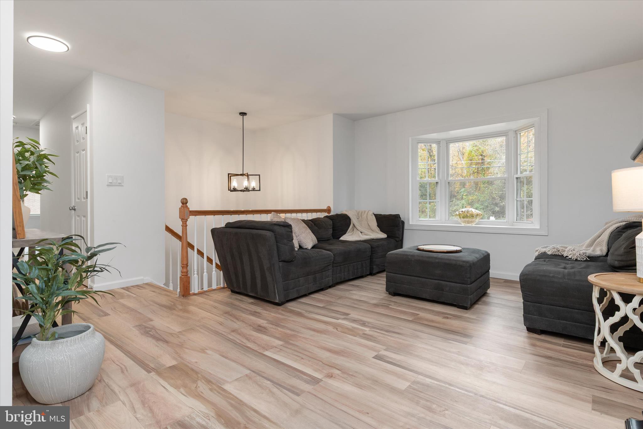 7963 Oak Road Pasadena, MD 21122 - Photo 2 of 53 a bedroom with a bed window and couch