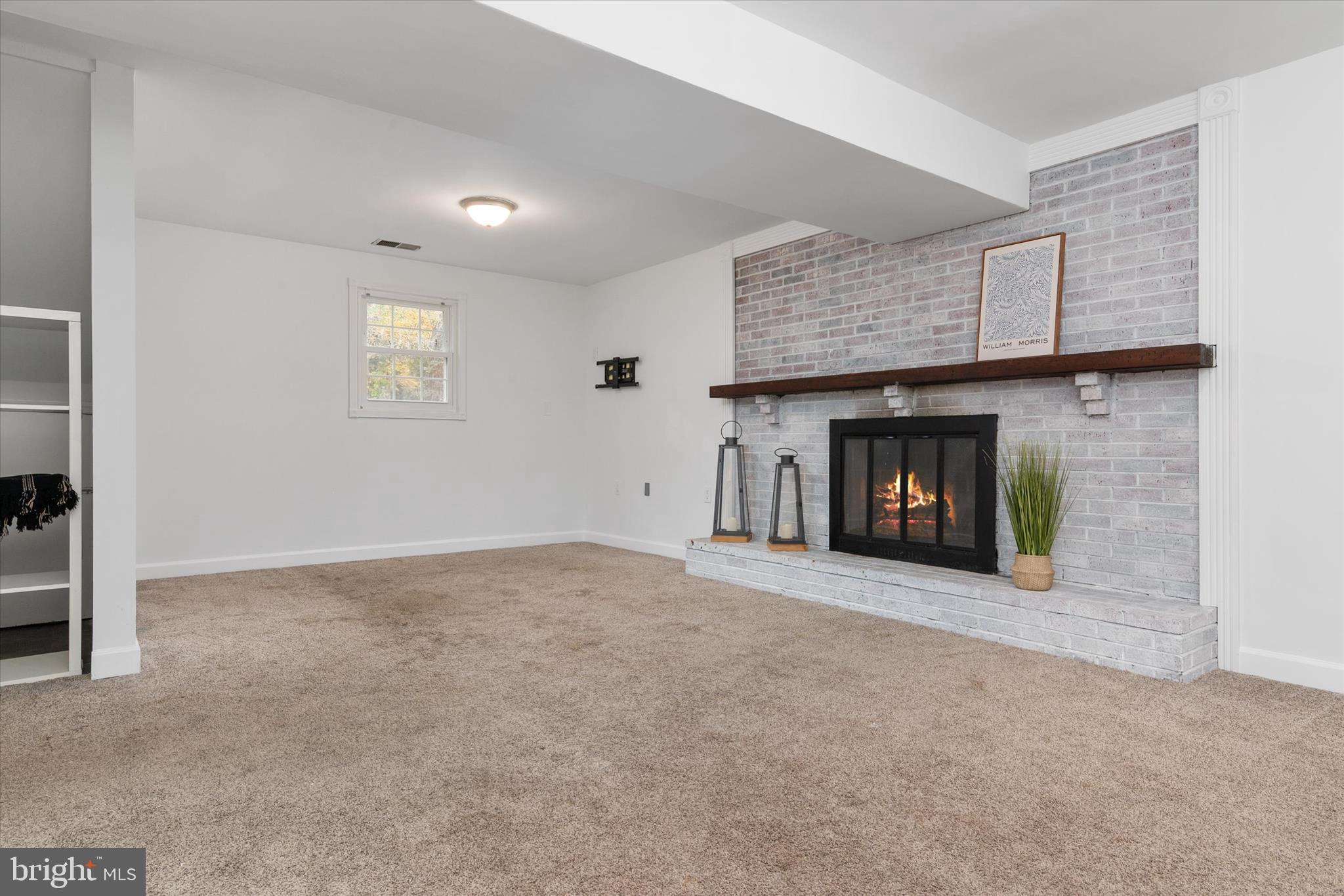 7963 Oak Road Pasadena, MD 21122 - Photo 23 of 53 a view of an empty room with a fireplace