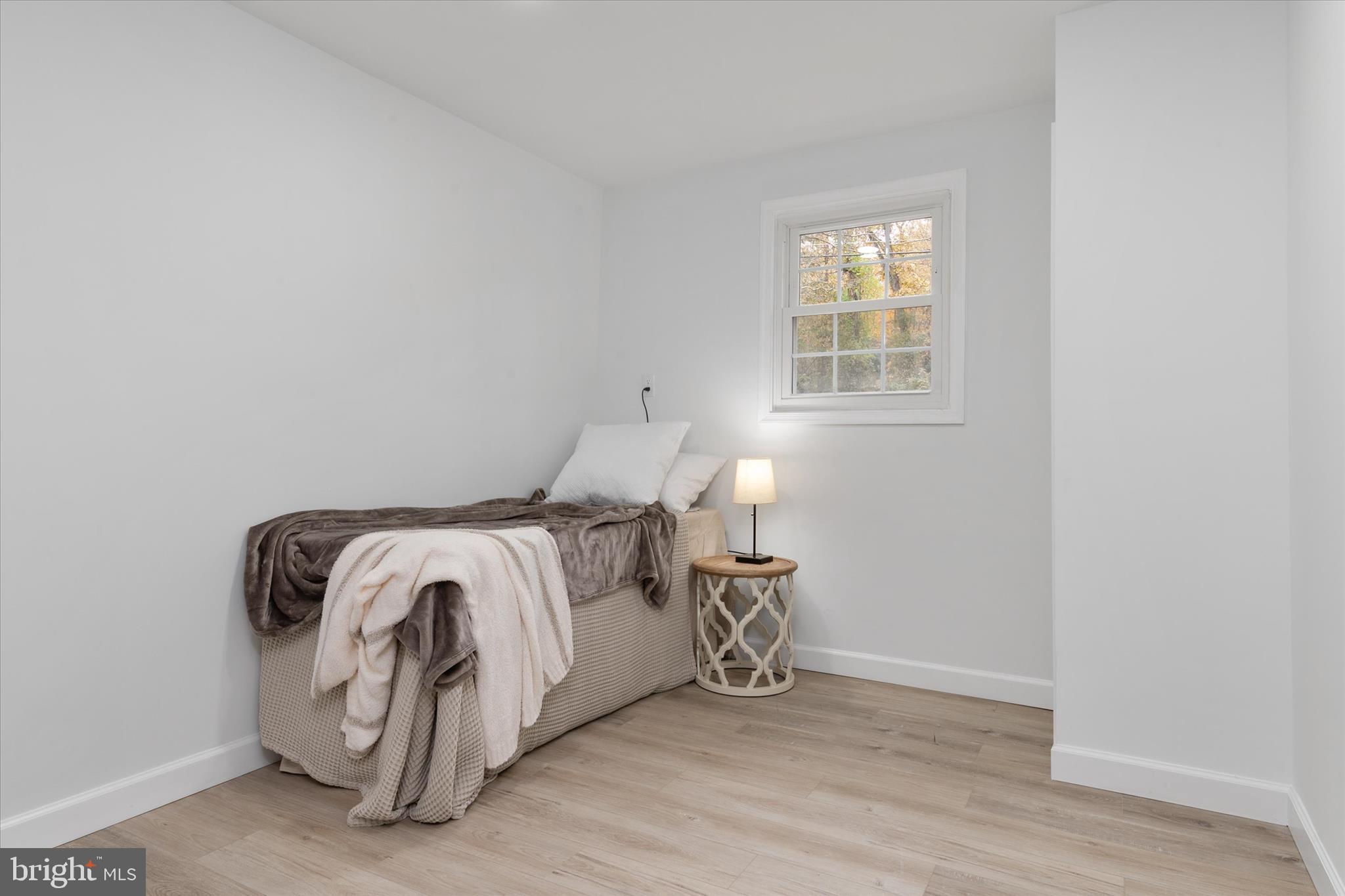 7963 Oak Road Pasadena, MD 21122 - Photo 25 of 53 a bedroom with a bed and a window