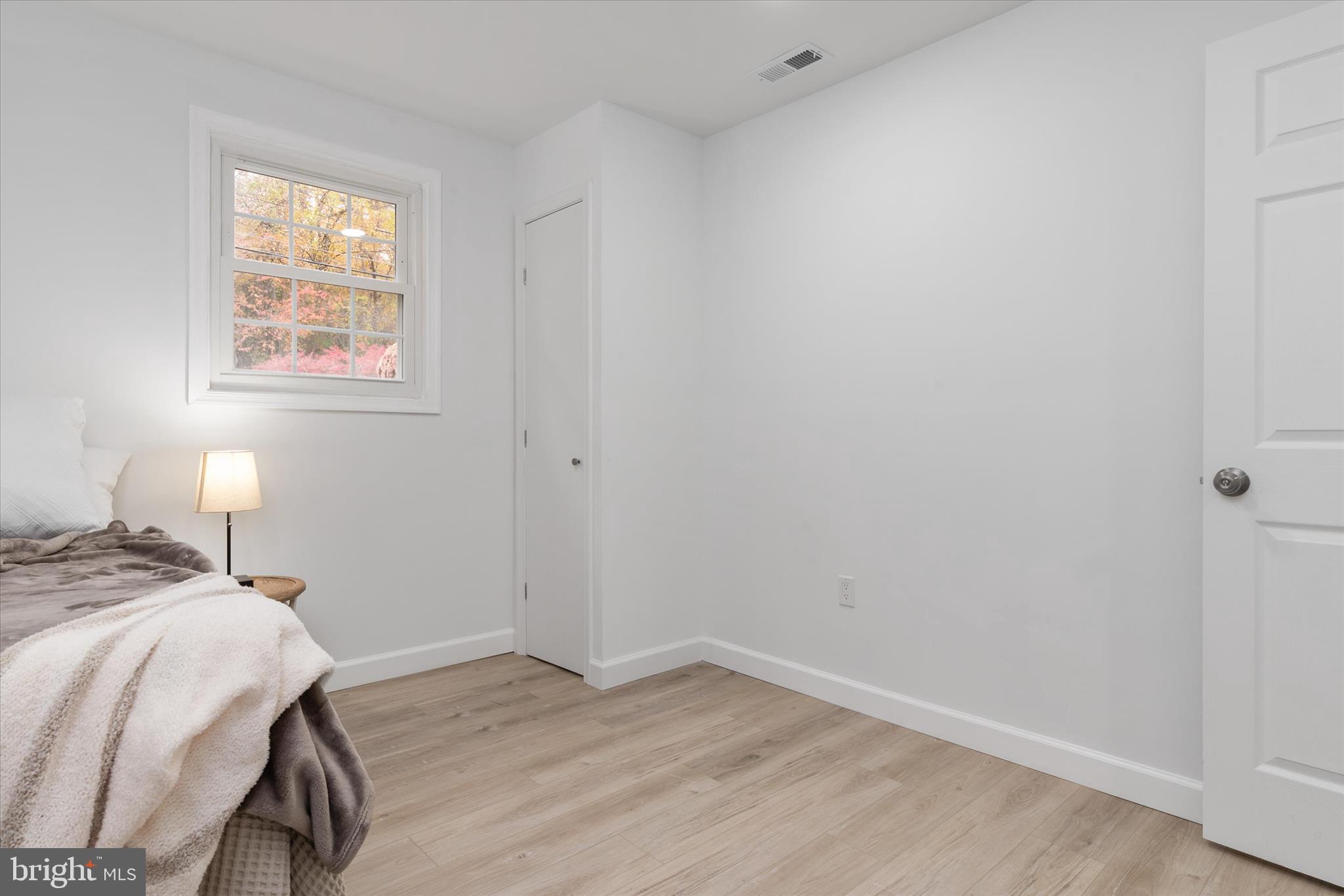 7963 Oak Road Pasadena, MD 21122 - Photo 26 of 53 a bedroom with a bed and a window