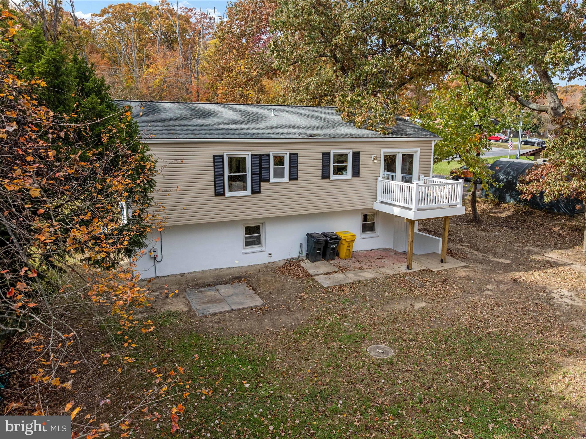 7963 Oak Road Pasadena, MD 21122 - Photo 39 of 53 a front view of a house with a yard and garage