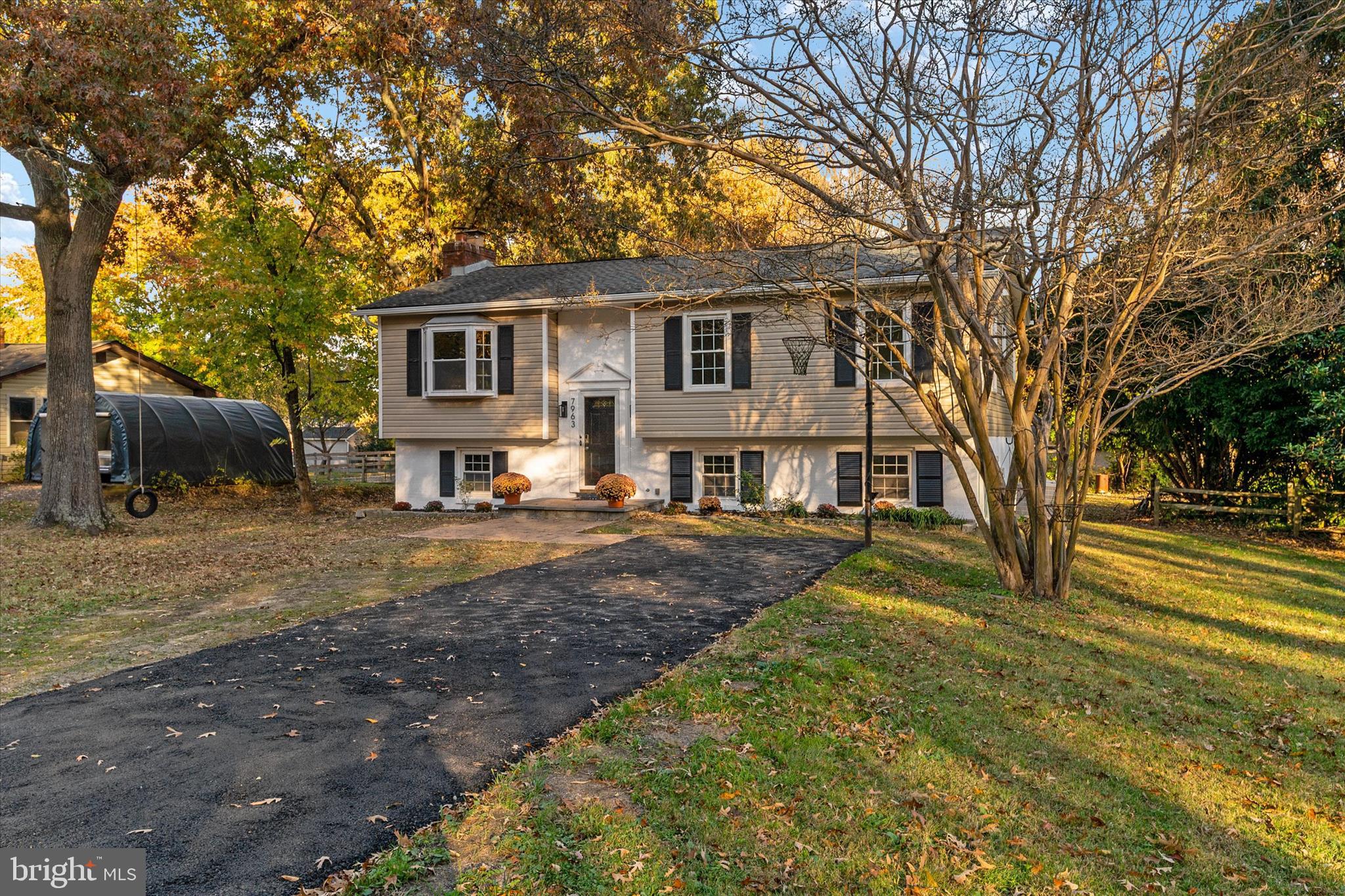 7963 Oak Road Pasadena, MD 21122 - Photo 51 of 53 a view of a yard in front of a house with a fountain