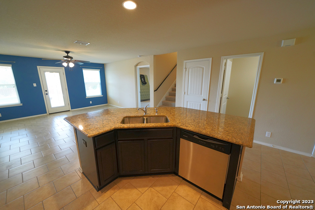 12316 Erstein Valley Schertz, TX 78154 - Photo 18 of 50 a kitchen with stainless steel appliances granite countertop a sink and a stove