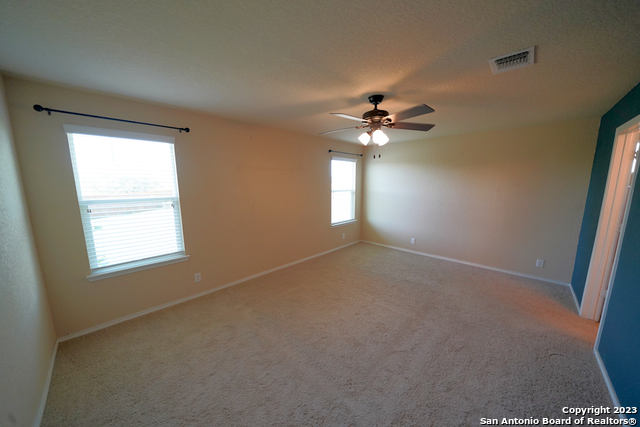 12316 Erstein Valley Schertz, TX 78154 - Photo 19 of 50 an empty room with windows and fan