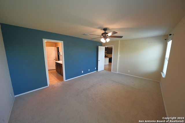12316 Erstein Valley Schertz, TX 78154 - Photo 21 of 50 a view of a livingroom with a chandelier fan and a chandelier fan