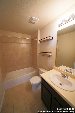 12316 Erstein Valley Schertz, TX 78154 - Photo 33 of 50 a bathroom with a sink toilet and shower